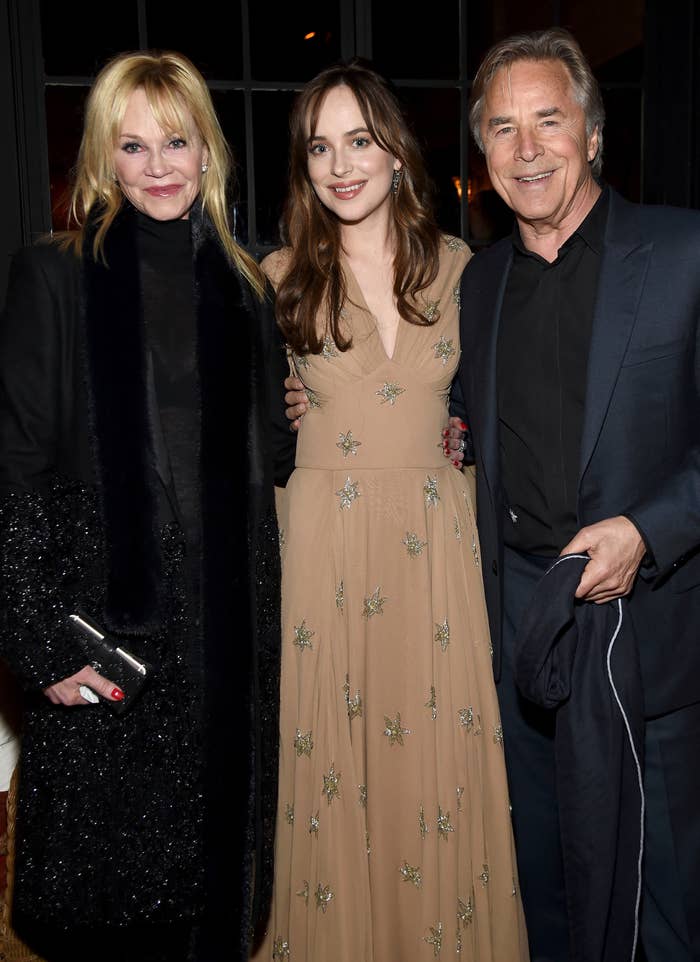Griffith, Dakota, and Don smile for a photo at an event