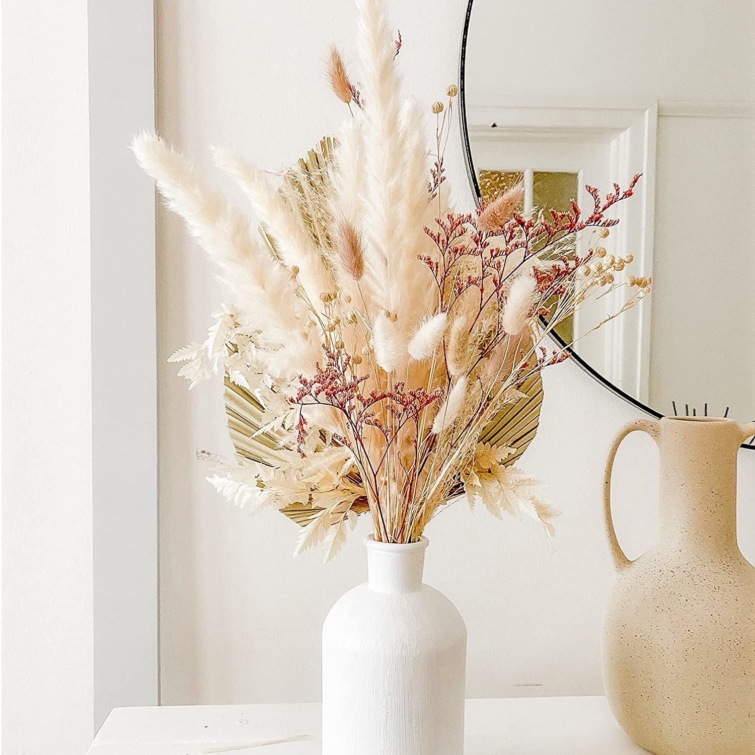 Dried bouquet displayed in a white vase