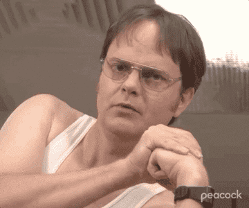 GIF of Dwight giving a back massage on the show &quot;The Office&quot;