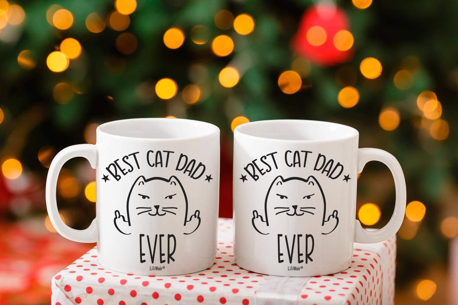 Two white mugs with a cartoon cat that say best cat mom ever and best cat dad ever