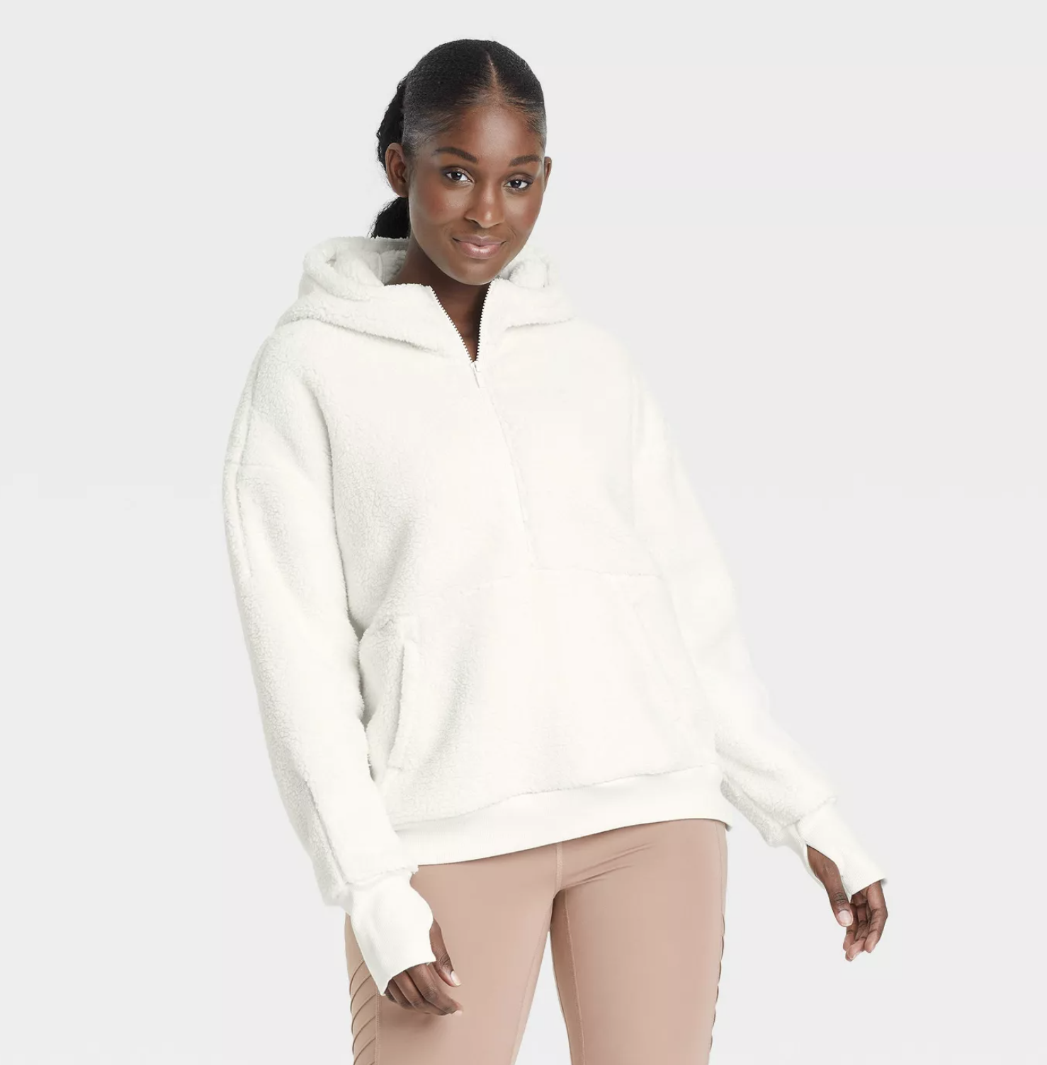 model wearing the hoodie in white