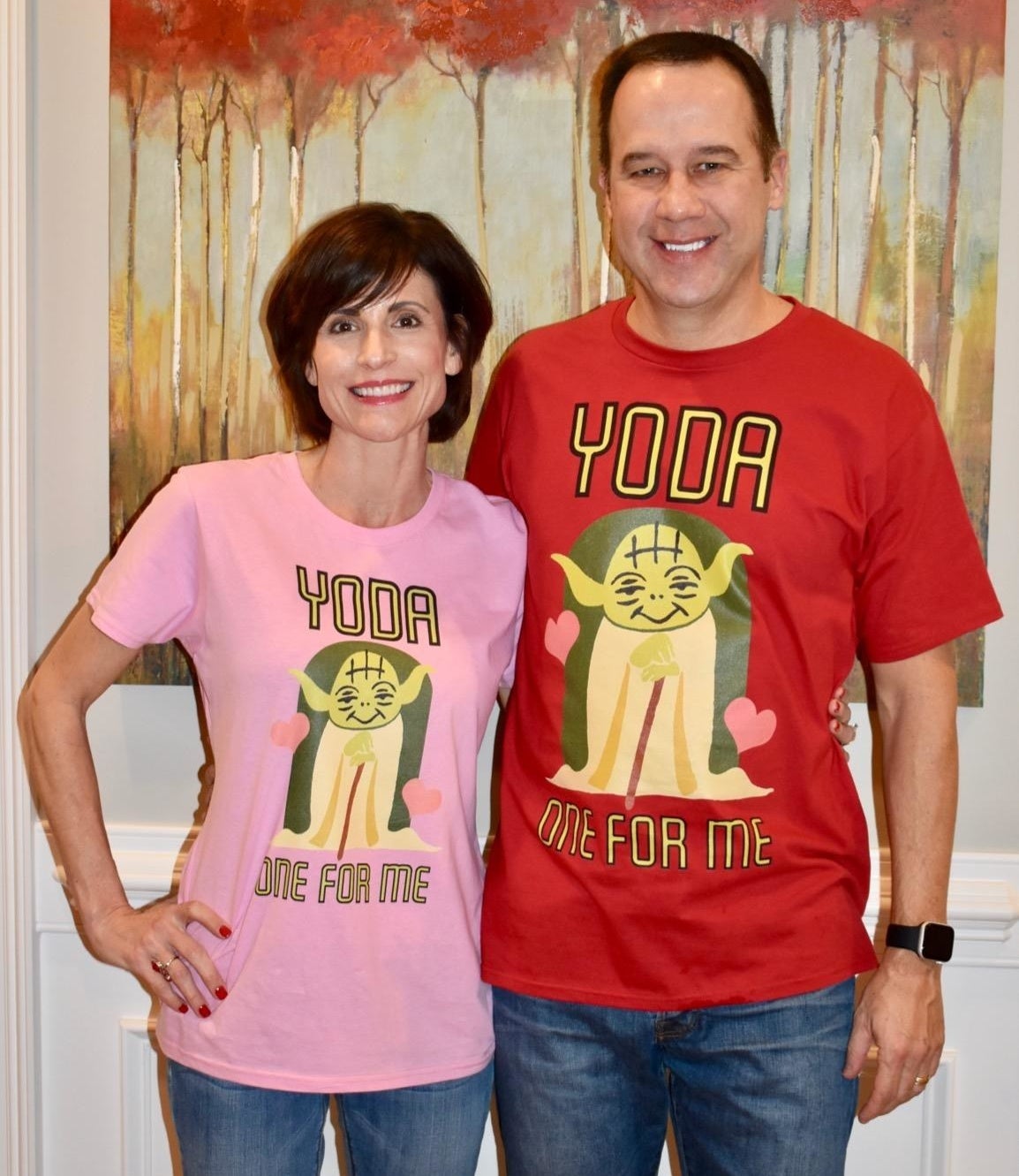 a pair of reviewer each wearing the shirt that says "yoda one for me"
