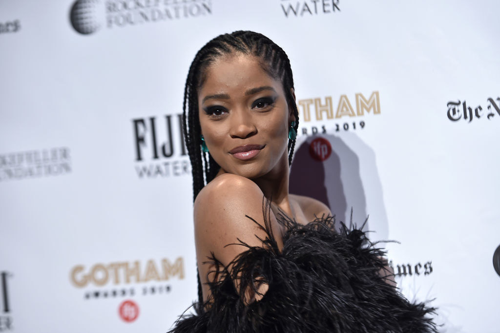 Keke Palmer looking over her shoulder as she poses on the red carpet of the 2019 Gotham Awards