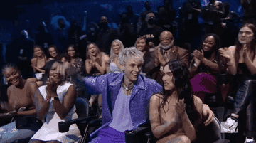 Machine Gun Kelly and Megan Fox touching tongues at the MTV Video Awards