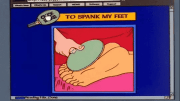 Peggy's feet being hit with a paddle on a webpage