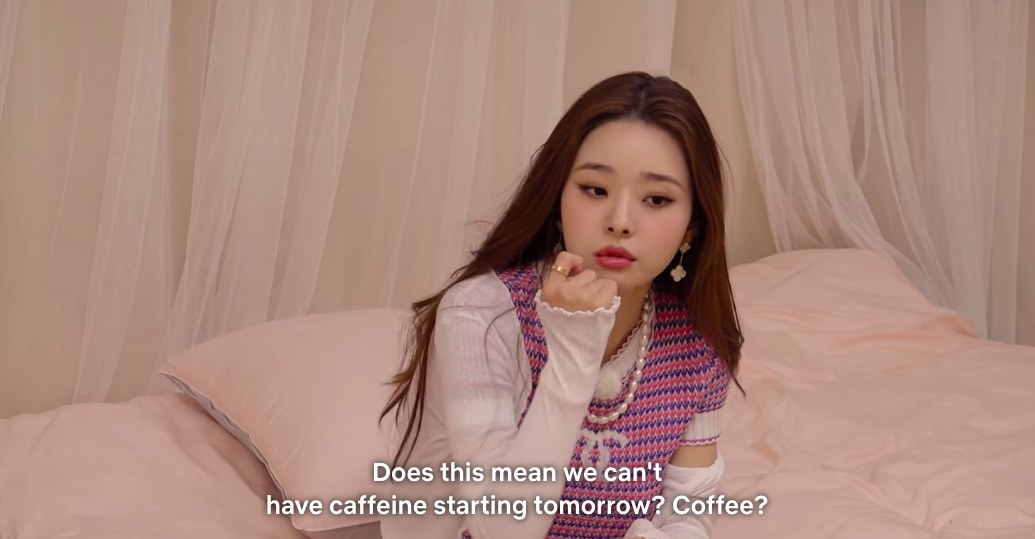 Ji-a sits on her bed and asks if they won&#x27;t be having caffeine starting tomorrow