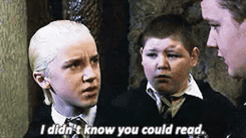 A close up of Draco Malfoy as he says, &quot;I didn&#x27;t know you could read&quot;