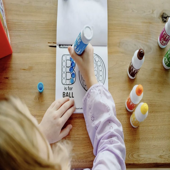 Child using Dot Art Kits