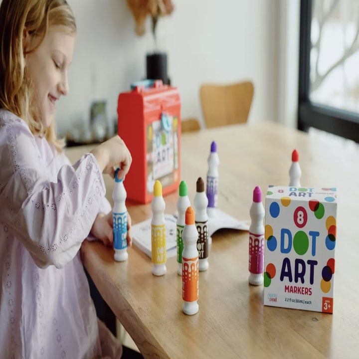 Child using Dot Art Kit