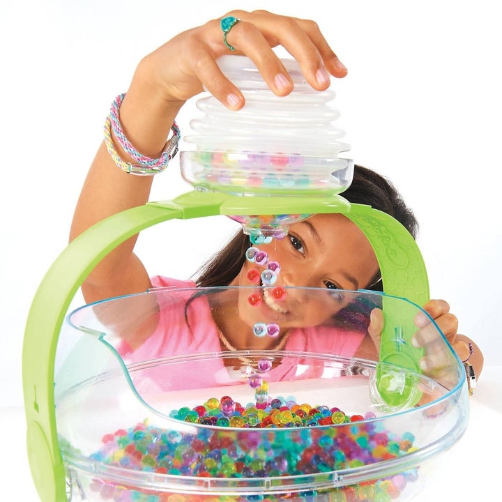 Child playing with orbeez