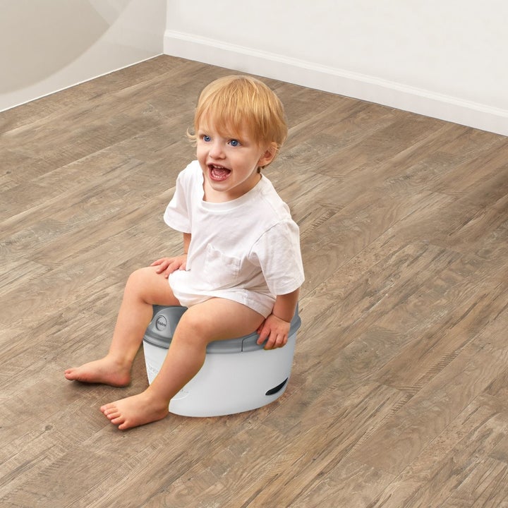 Child sitting on potty