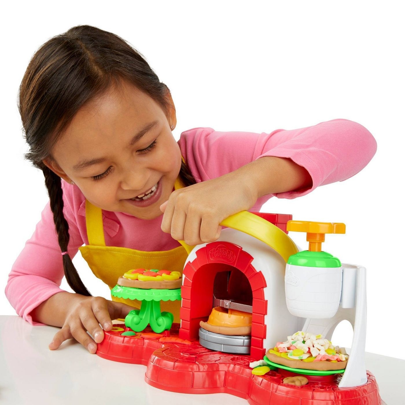 Kid playing with playdoh pizza oven