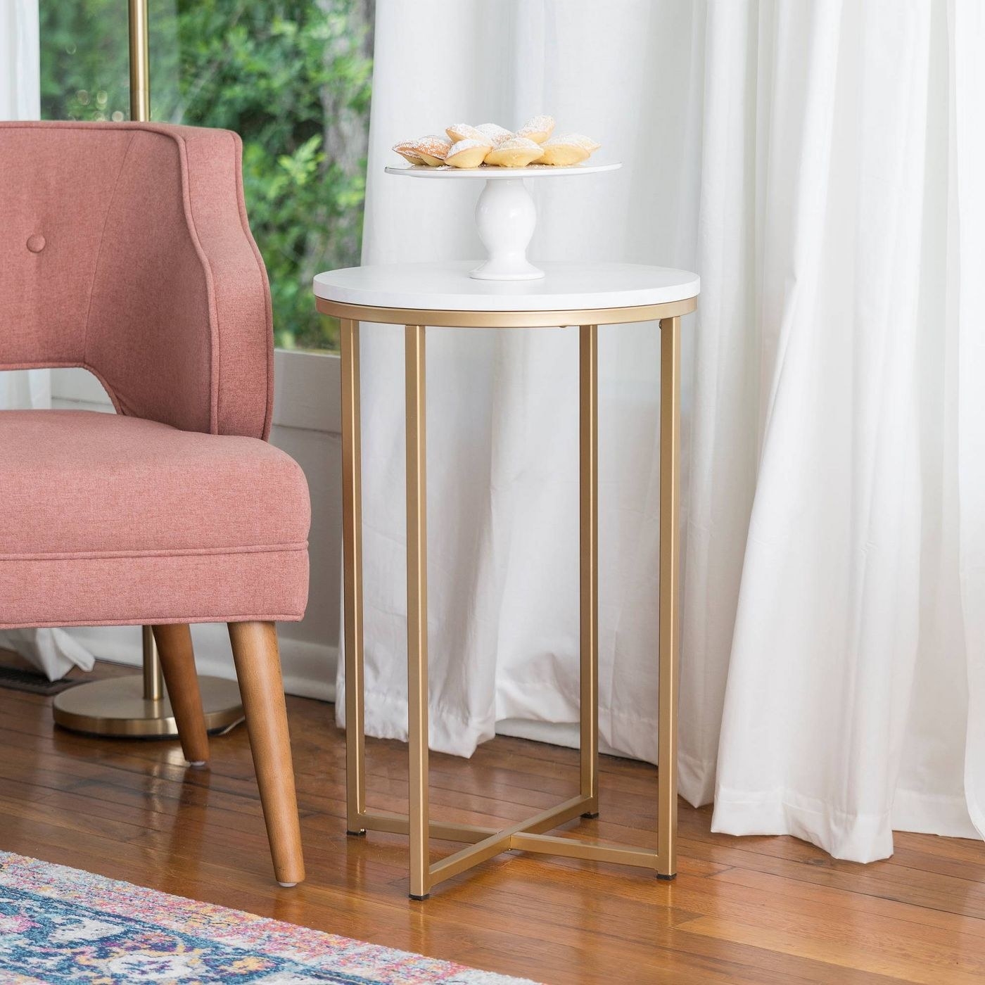 round side table with faux marble top and gold legs