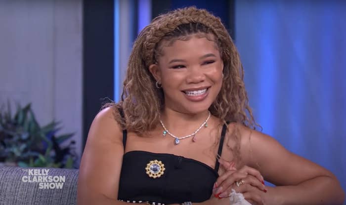 Storm smiles while being interviewed on the show