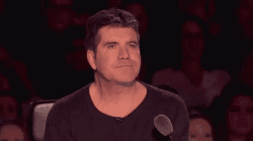 A Simon Cowell making him seem like pointing lasers through his eyes