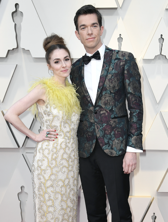 Anna Marie and John posing together on the Oscars red carpet