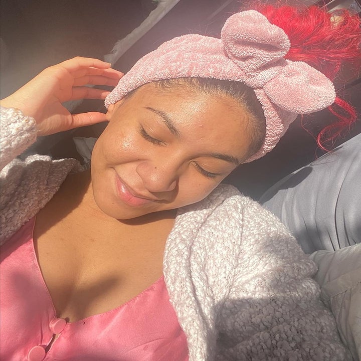 close up of reviewer wearing the pink headband