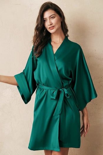 Model wearing the short, three-quarter sleeve robe in green