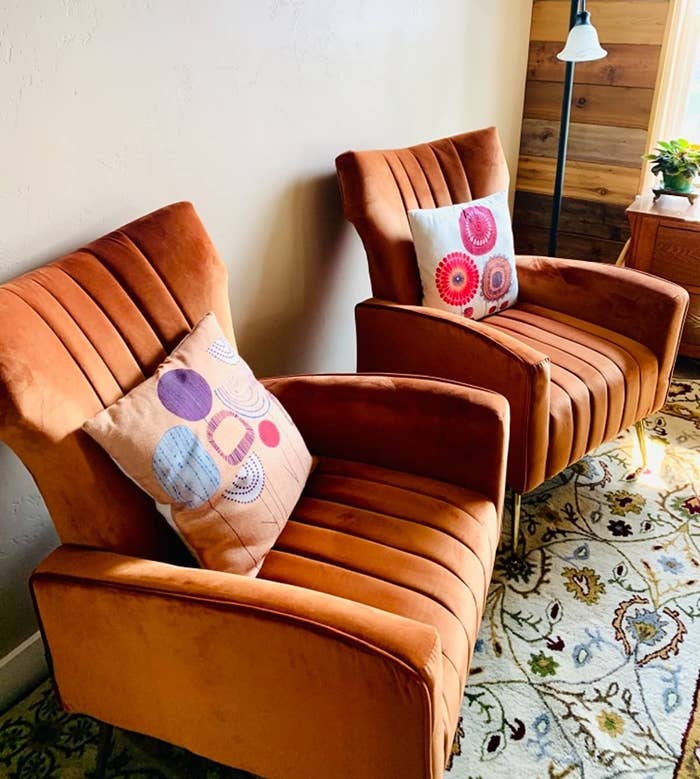 reviewer image of two caramel colored chairs in a living area