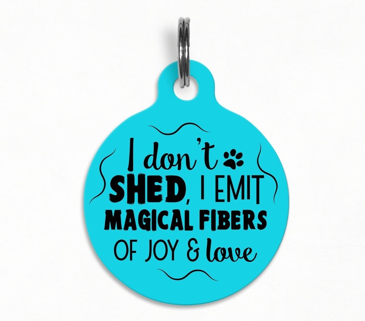 Dog tag that reads &quot;I don&#x27;t shed, I emit magical fibers of joy and love&quot;