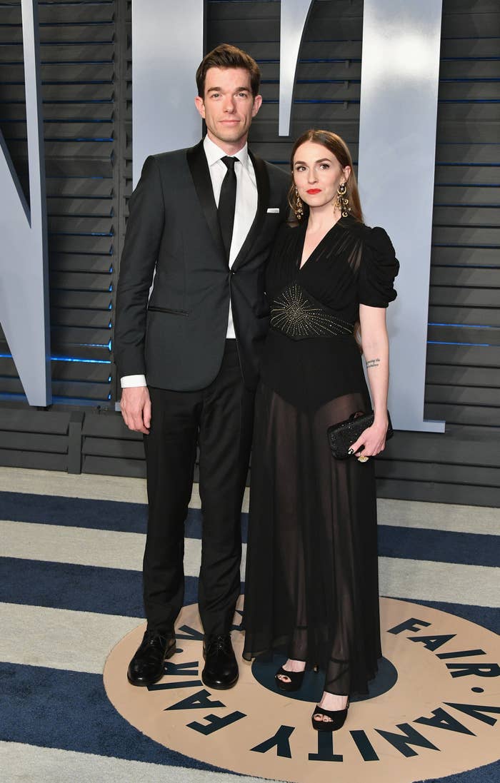 John and Anna Marie posing for photographers at the Vanity Fair Oscars After Party