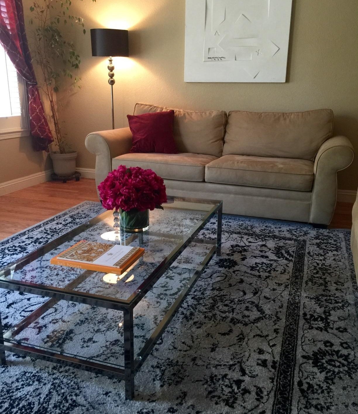 reviewer image of the gray and black rug on their living room floor