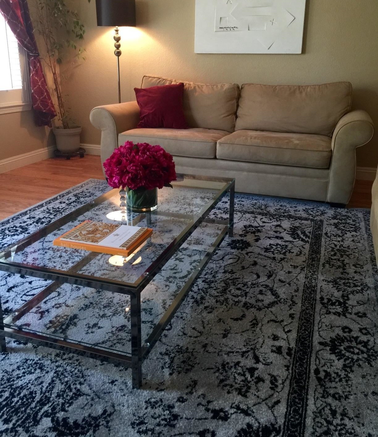 reviewer image of the gray and black rug on their living room floor