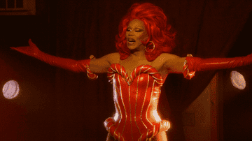 RuPaul raises his arms into the air and smiling brightly as Ruby on &quot;AJ and the Queen&quot;