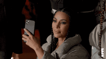 Kim Kardashian crying and videotaping something on her phone