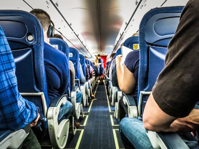 Rows of passengers seated on a plane
