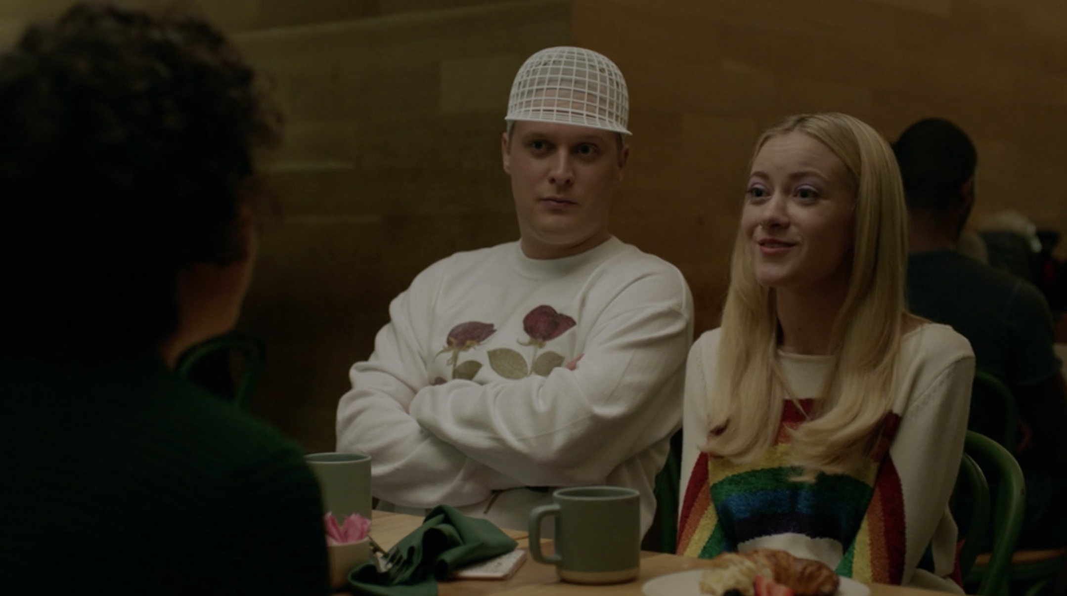 John Early and Meredith Hagner sitting at a table.