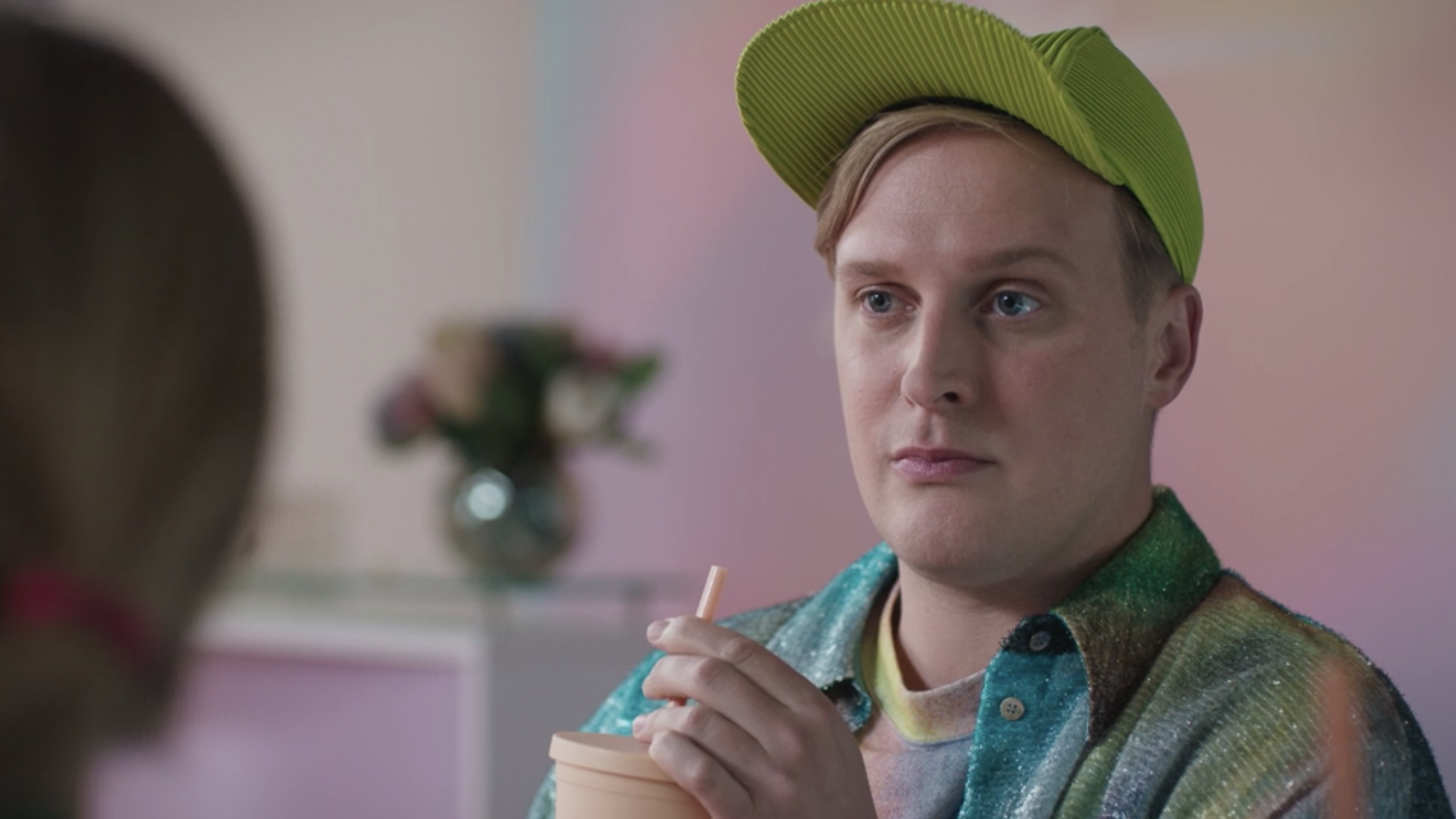 John Early holding a drink.