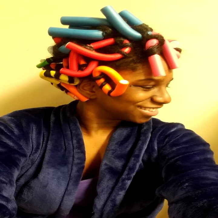 reviewer wearing the curling rods in their hair