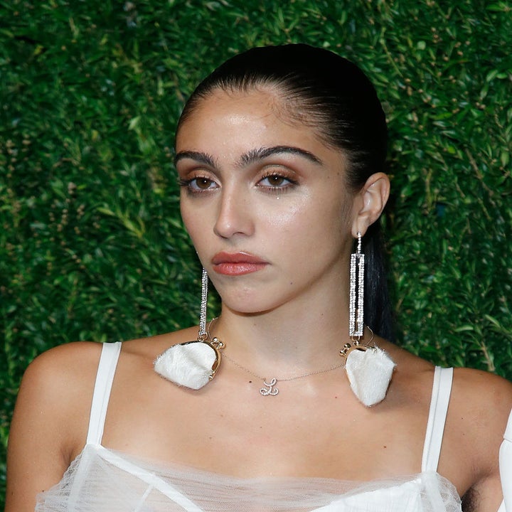 Lourdes Leon wearing a white outfit and large earrings