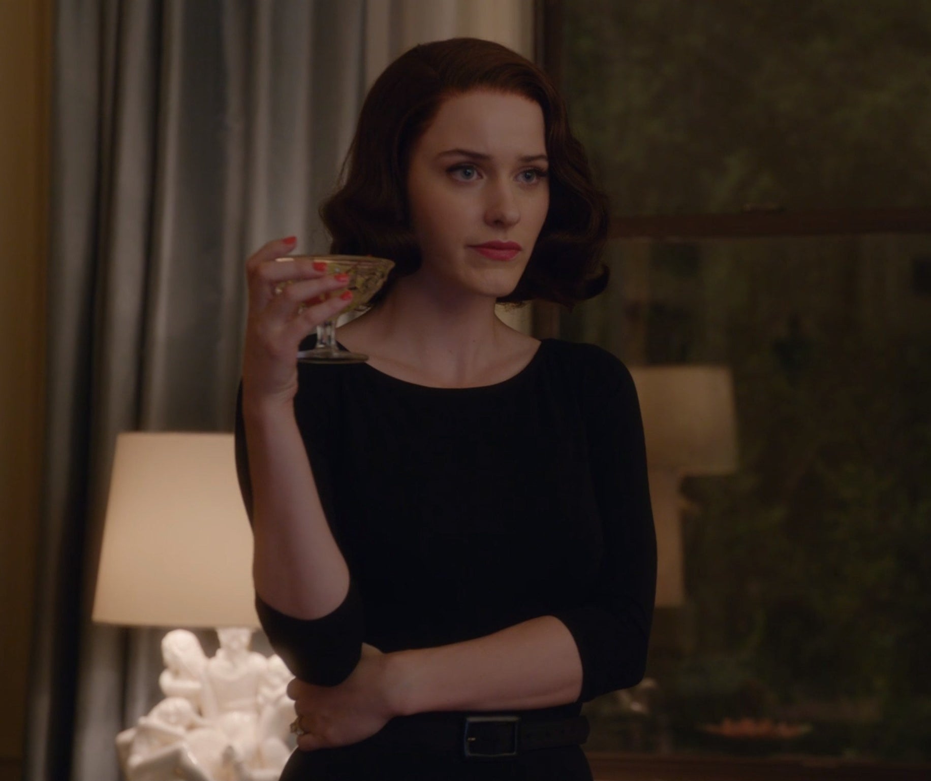 Screenshot from Mrs. Maisel shows Midge in a black dress