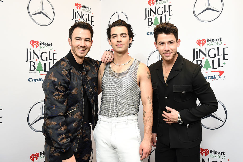 Kevin, Joe, and Nick Jonas on a red carpet