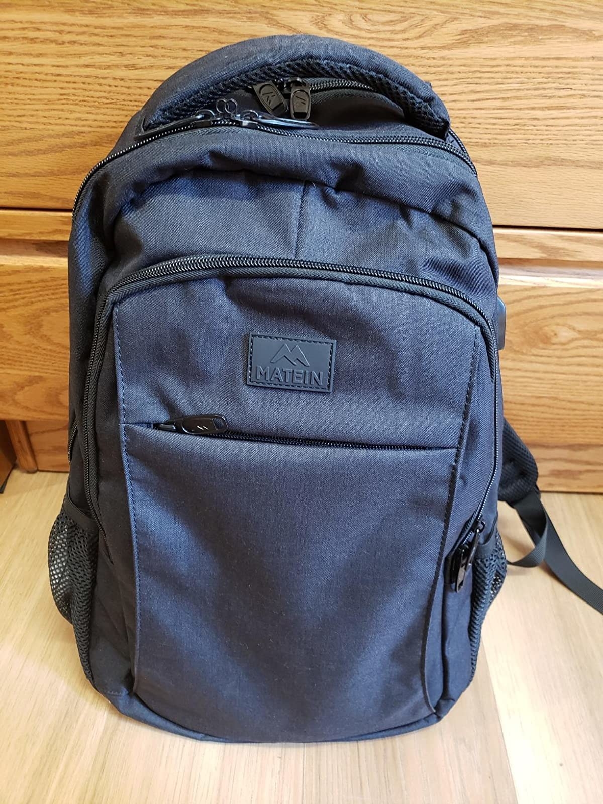 Reviewer photo of the navy blue backpack