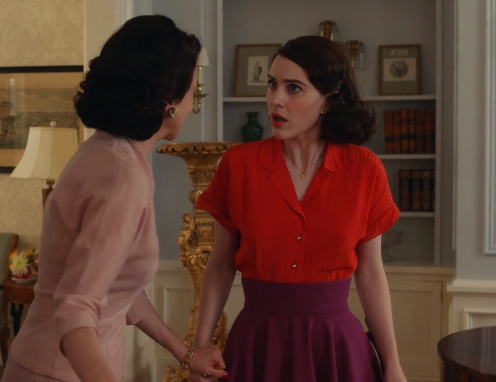 Screenshot from Mrs. Maisel shows Midge in a red top and purple skirt