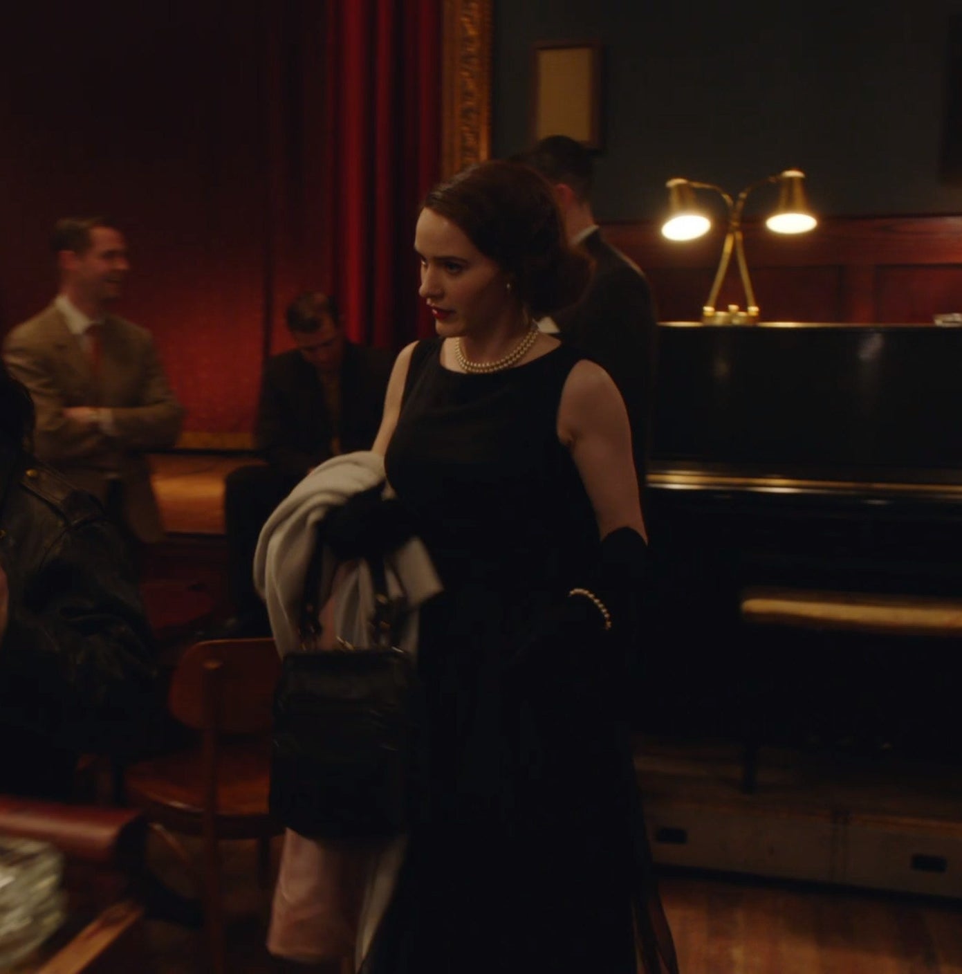 Screenshot from Mrs. Maisel shows Midge in a bar