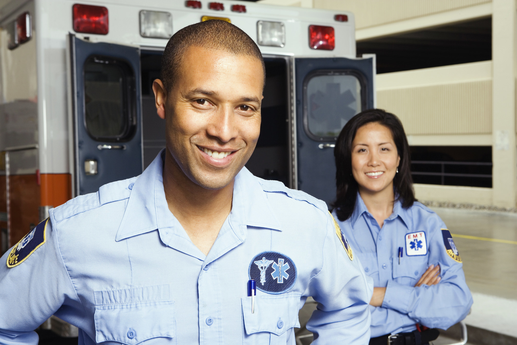 Paramedics in front of an ambulance