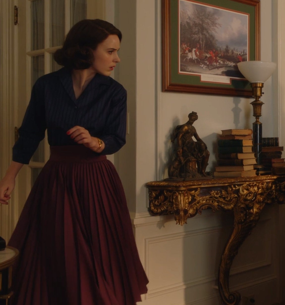 Screenshot from Mrs. Maisel shows Midge in a long skirt and button up shirt