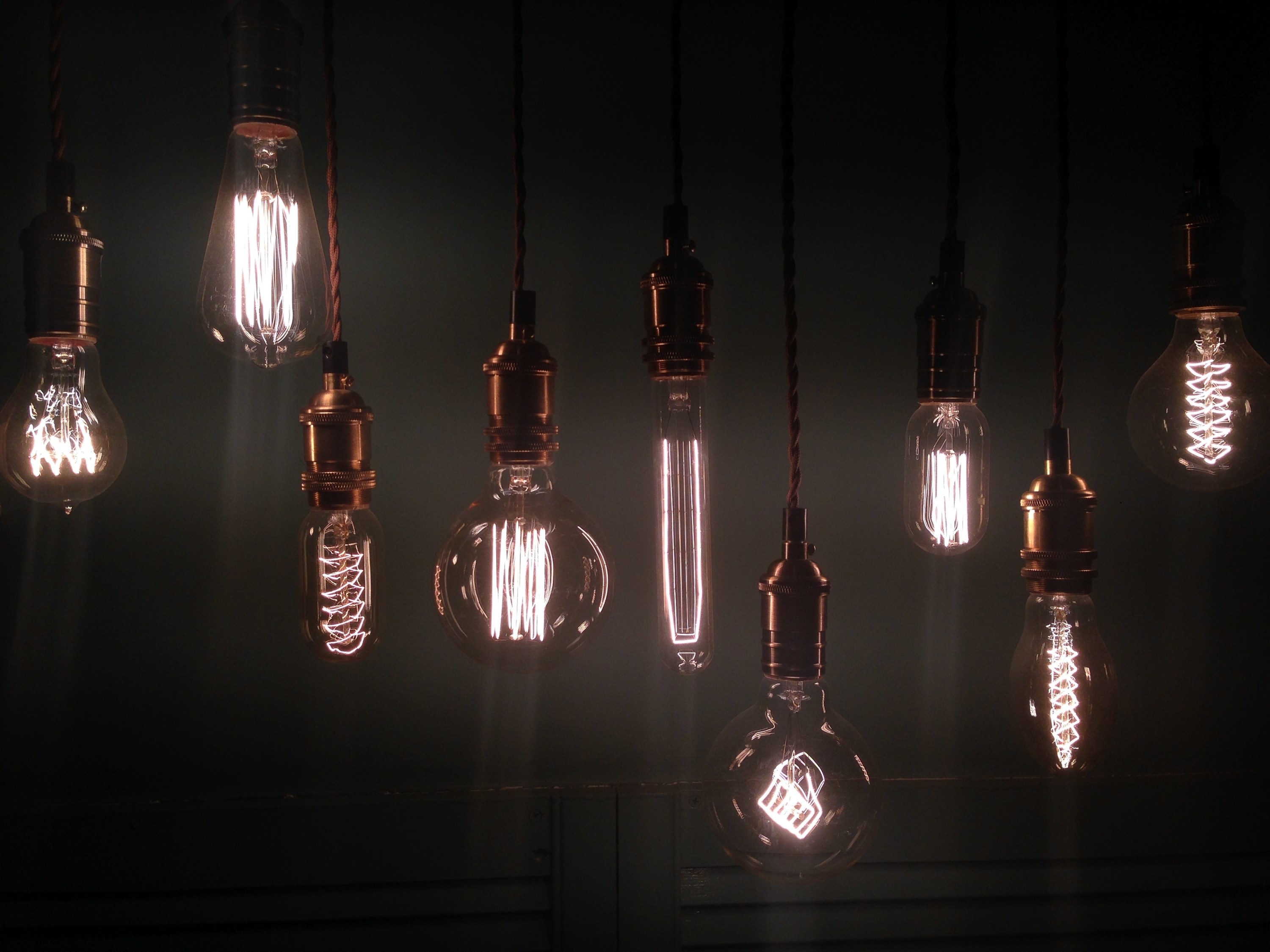 Exposed lightbulbs hang from the ceiling
