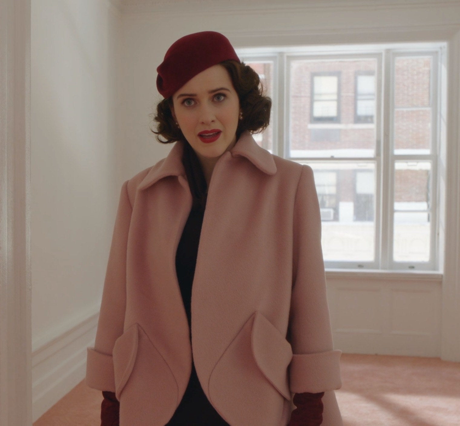 Screenshot from Mrs. Maisel shows Midge in a coat