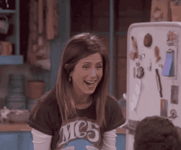 Rachel from Friends doing a two-handed fist pump