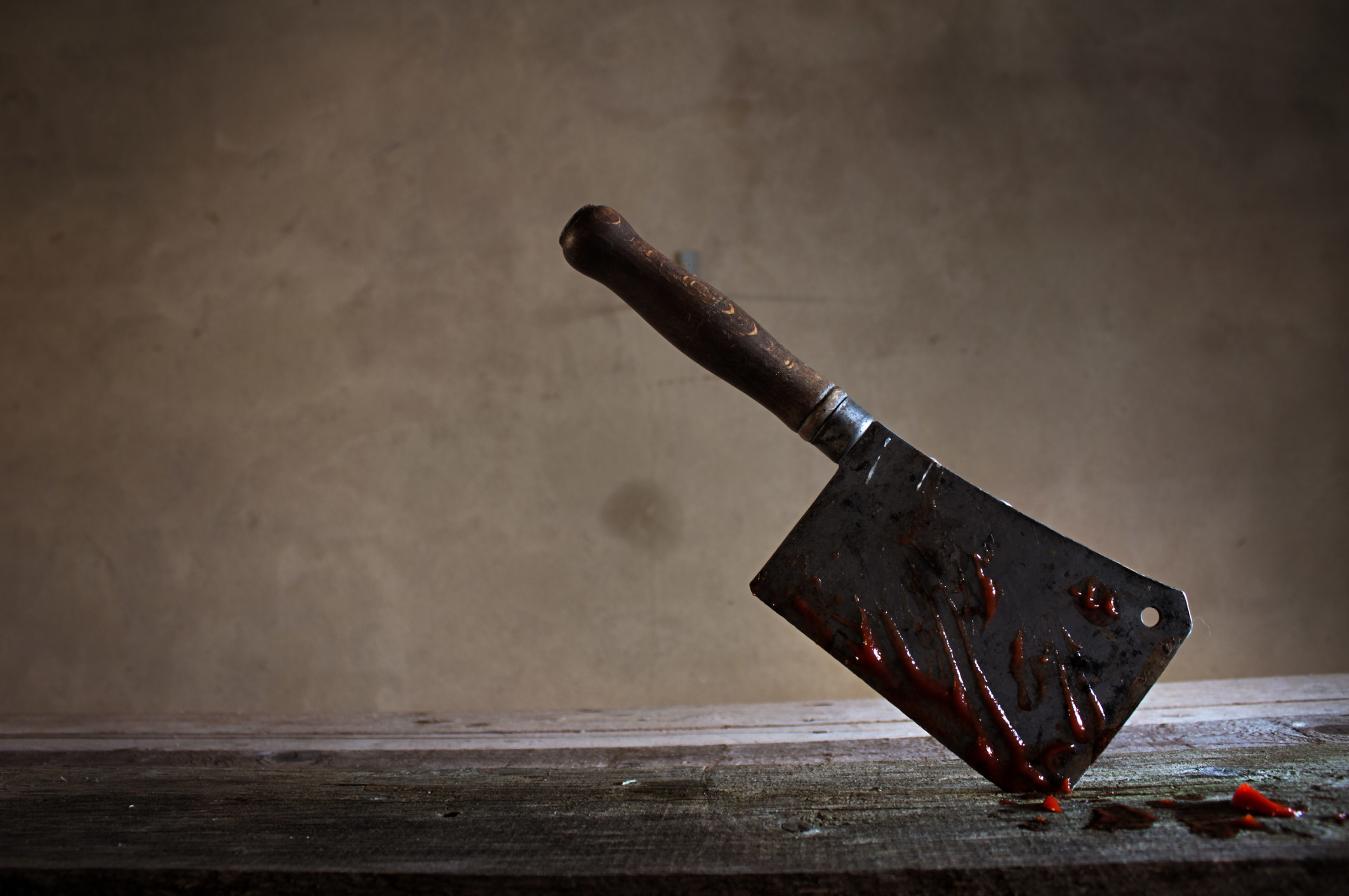 A stock photo of a bloody butcher knife