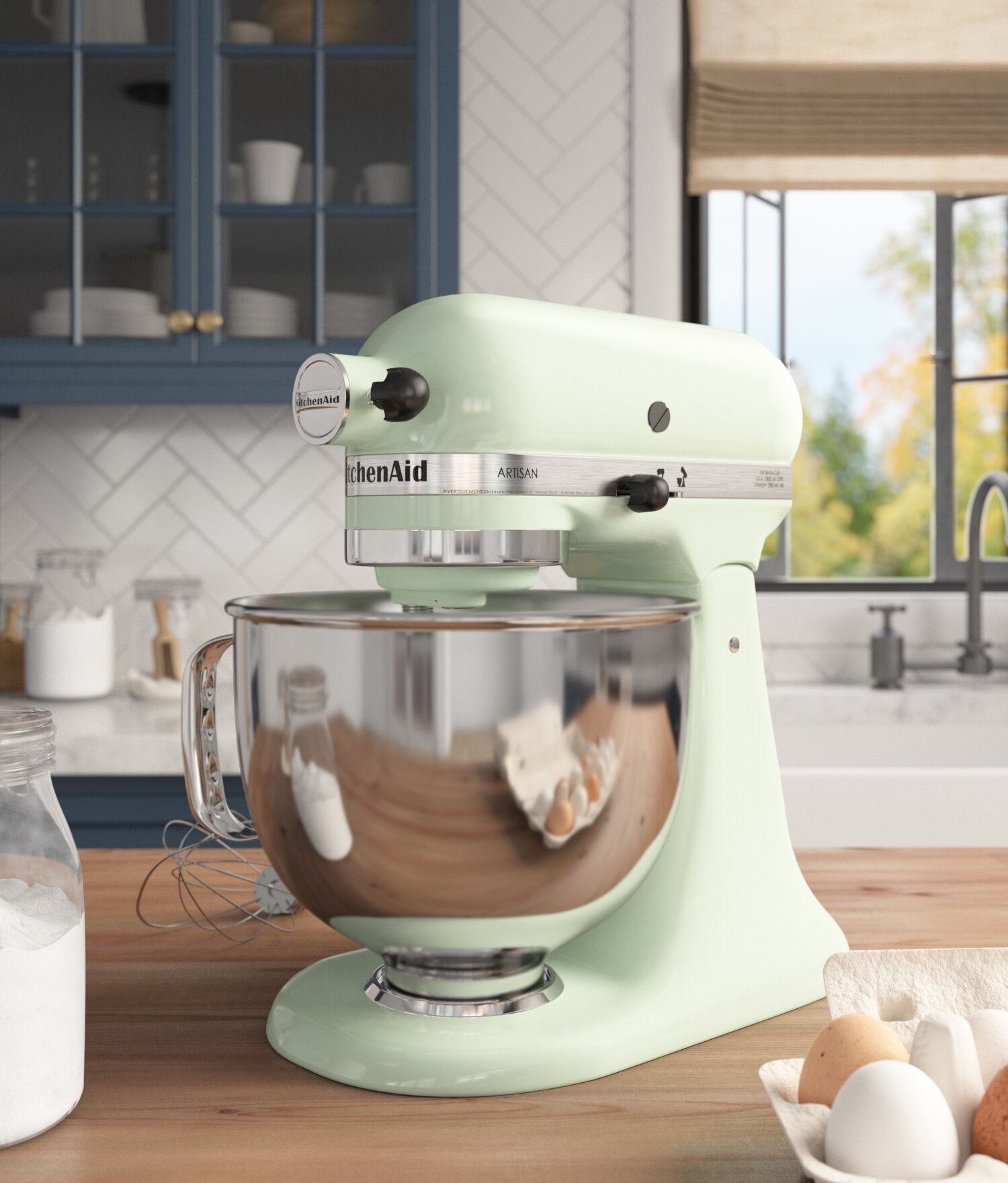The mint green stand mixer with metal bowl