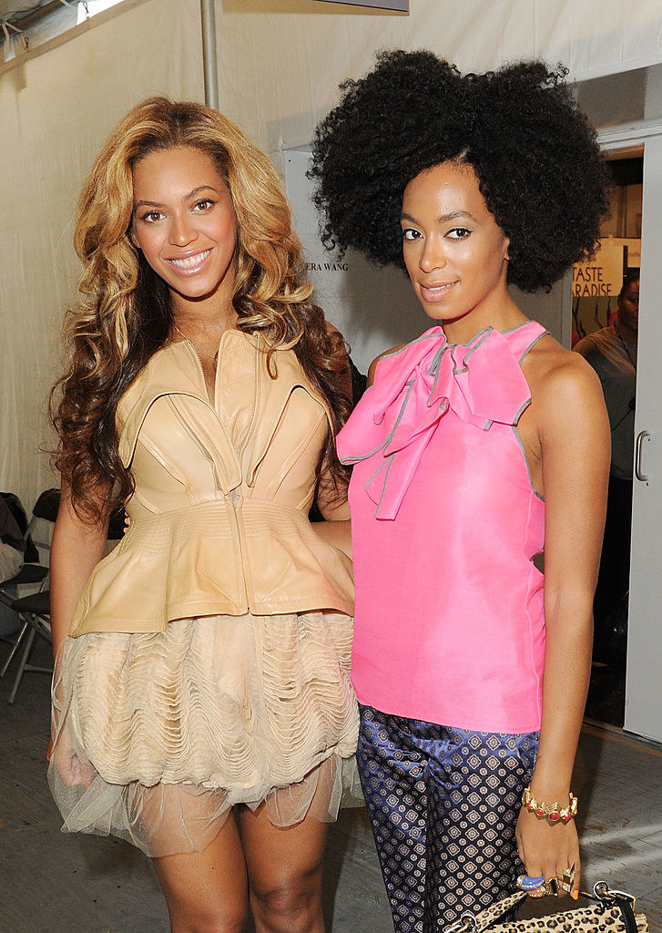 Beyonce and Solange posing for a picture