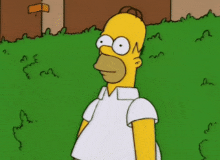 Gif of Homer Simpson nervously backing up into a bush and hiding in it