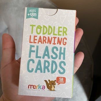 reviewer holding the pack of flash cards