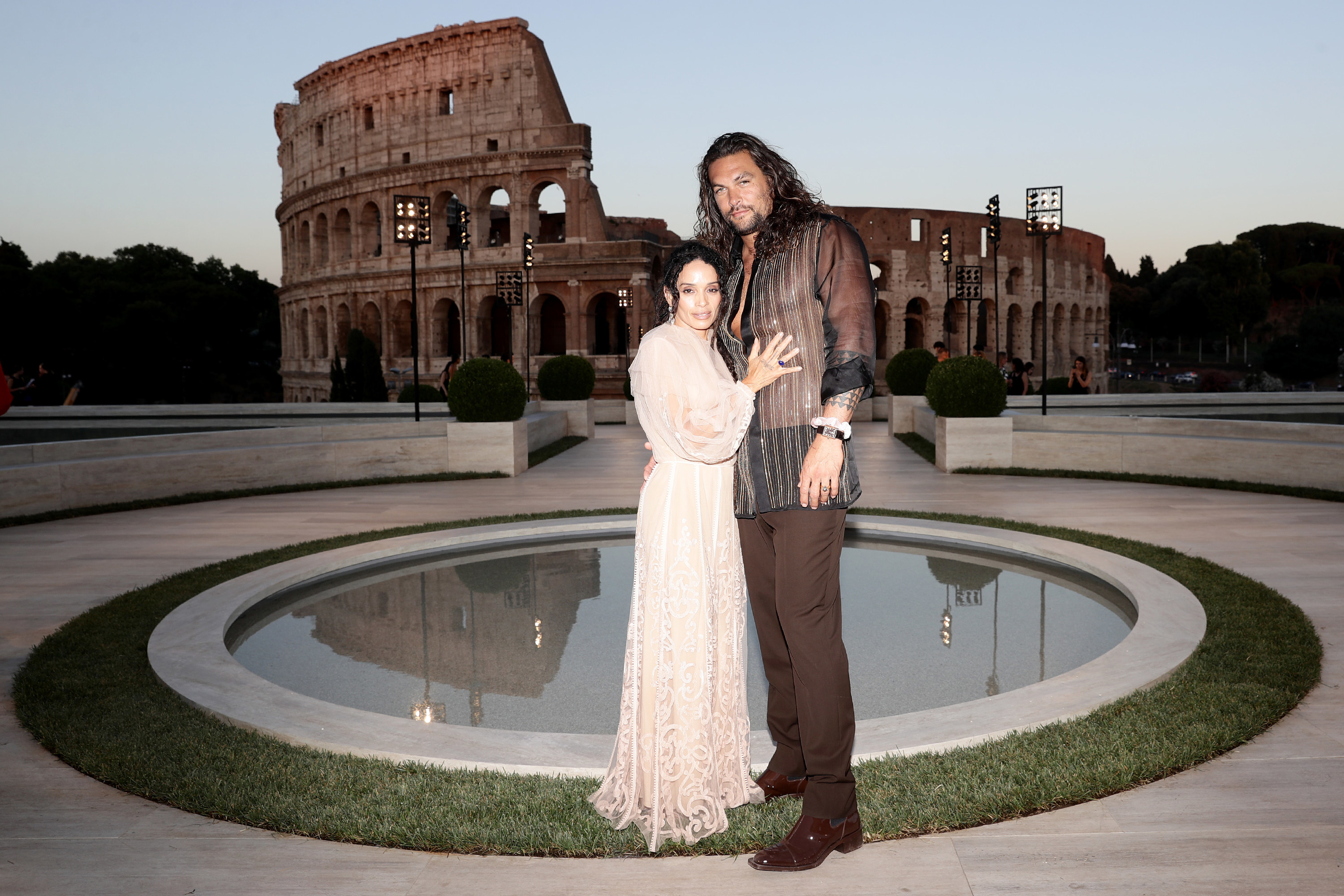 Jason Momoa and Lisa Bonet pose in front of the Coliseum